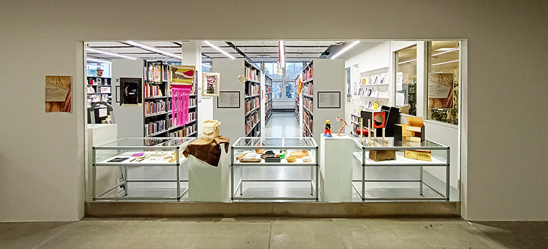 The library's storefront window showing an exhibition by Teacher Education students