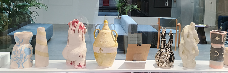 Teacher education students show ceramic vessels